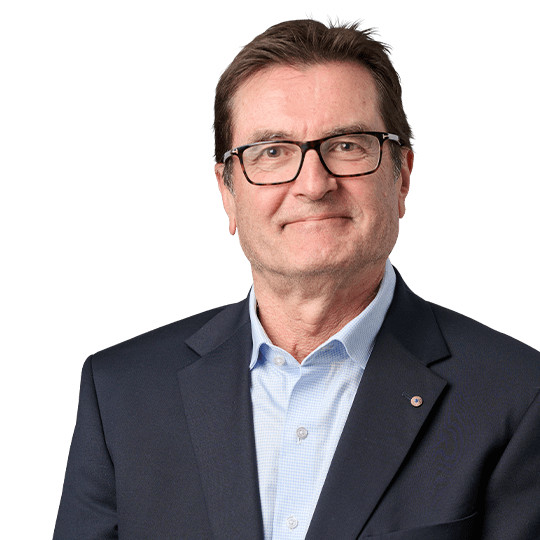 Greg Combet sitting down and facing the camera.