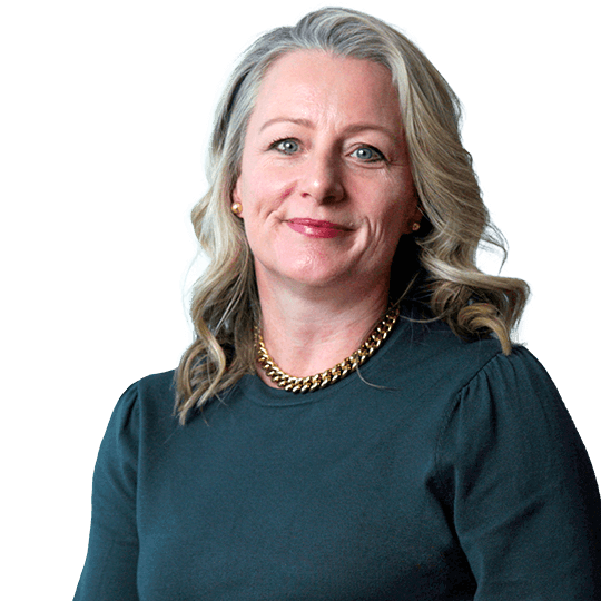 Kirsten Simpson sitting down and facing the camera.